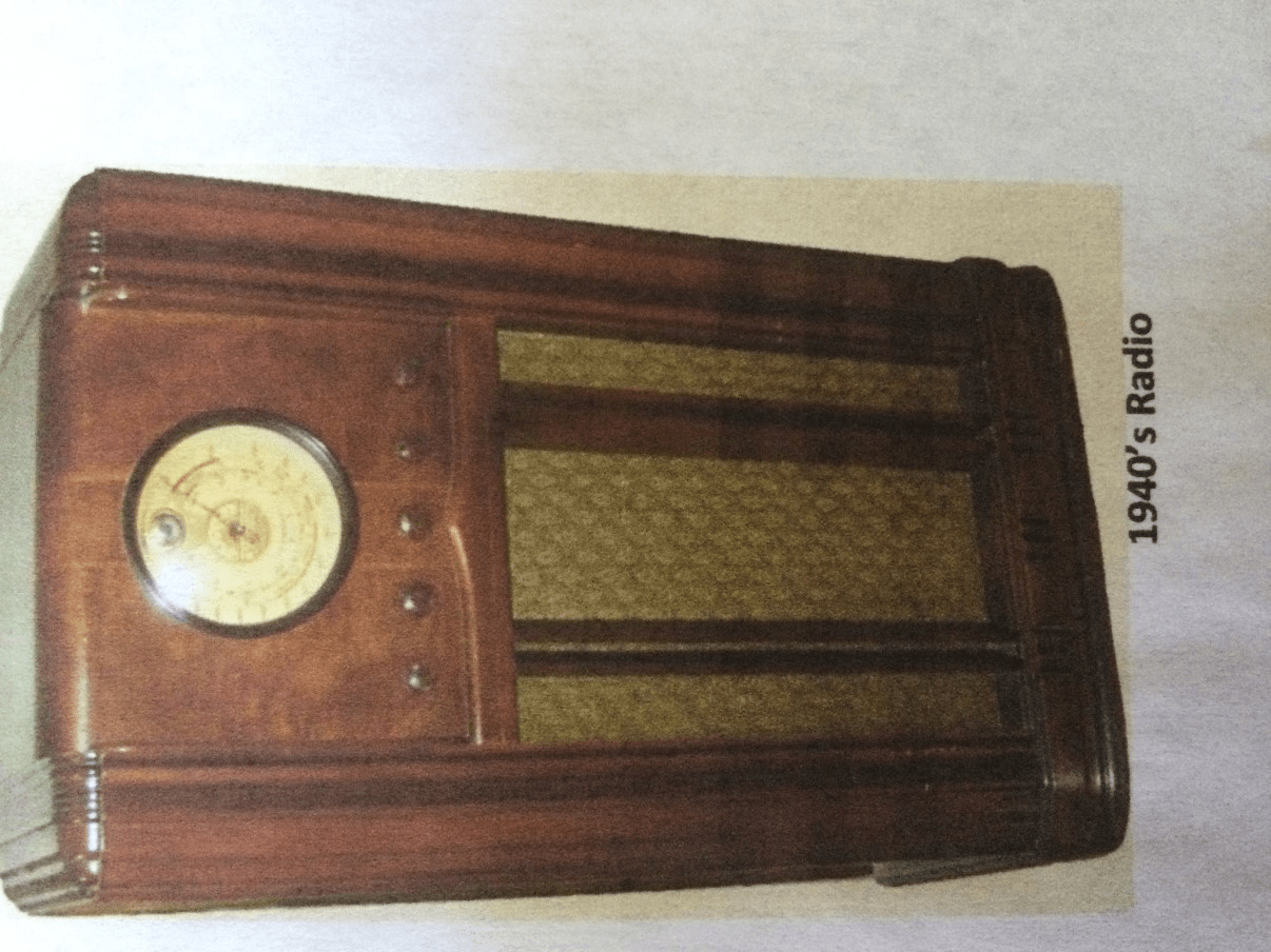 Tall freestanding antique wooden console radio from the 1930s or 1940s.