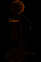 Historic black candlestick telephone with a stand-up mouthpiece and a separate hanging receiver.