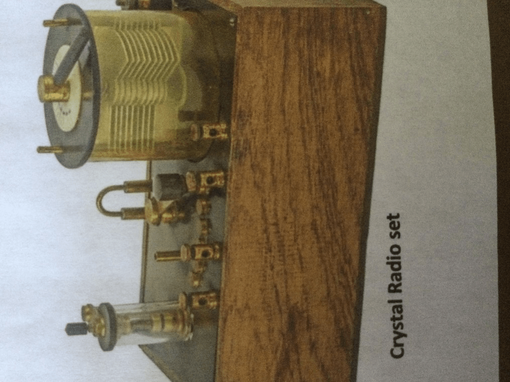 Internal components of a historic radio receiver, showing coils, valves, and wiring.