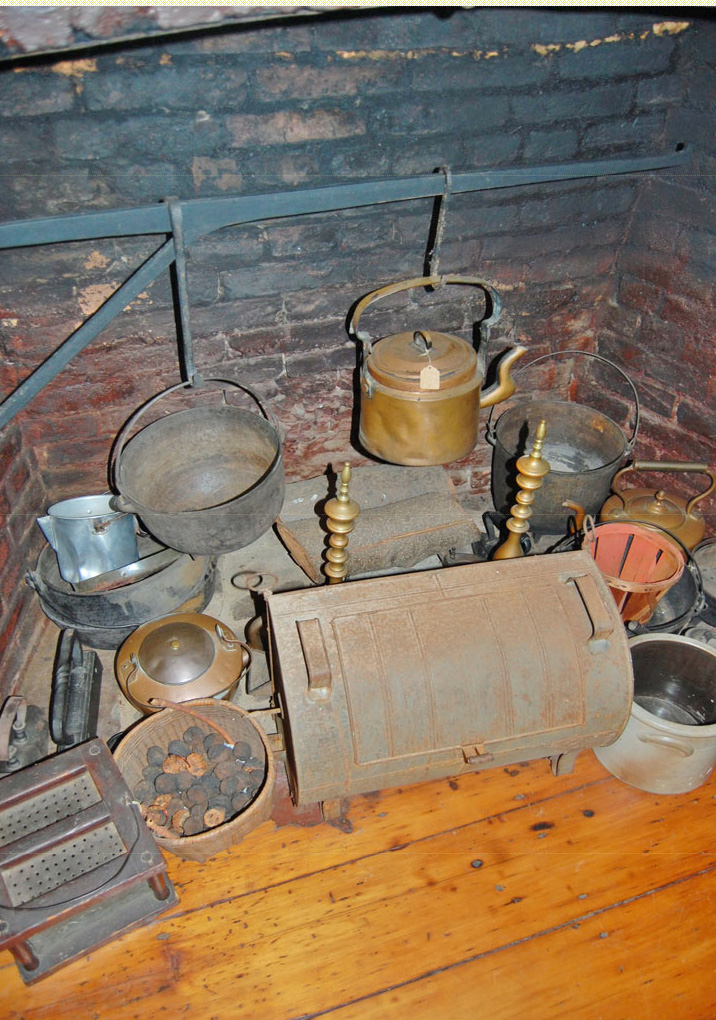 Hearth cooking display with kettles, crane, and reflector oven at the Woodruff House in Hillside, New Jersey