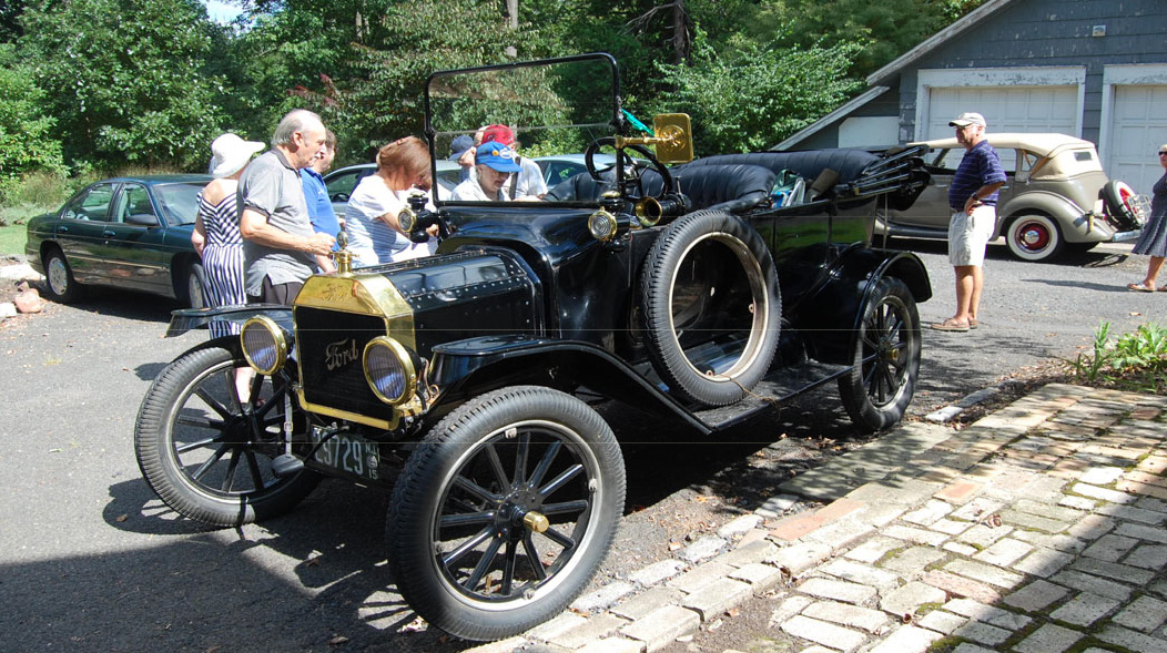 Attendees viewing a 1915 Ford Model T displayed during the Union County Historical Society annual picnic at the Hanson House