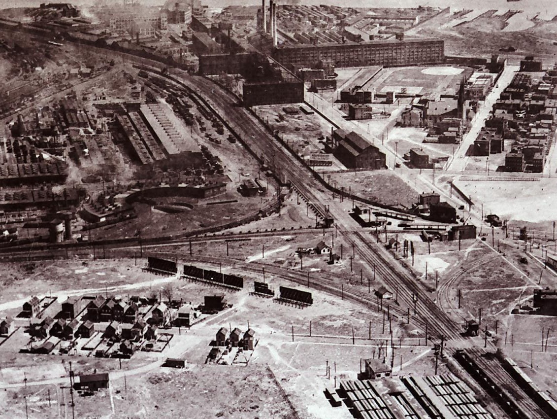 Aerial view of the Central Railroad Elizabethport station area in 1923, showing rail lines, maintenance shops, and nearby industry