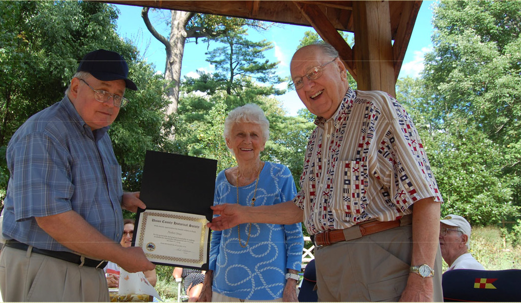 Presentation of a certificate of appreciation to Herb Singe during the Union County Historical Society annual picnic at the Hanson House