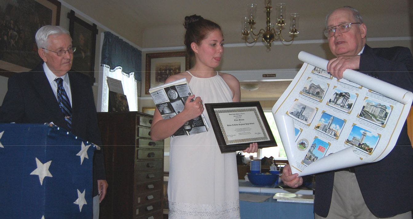 Elise Morano of Union Catholic Regional High School receiving a Union County Historical Society student award at the Hanson House