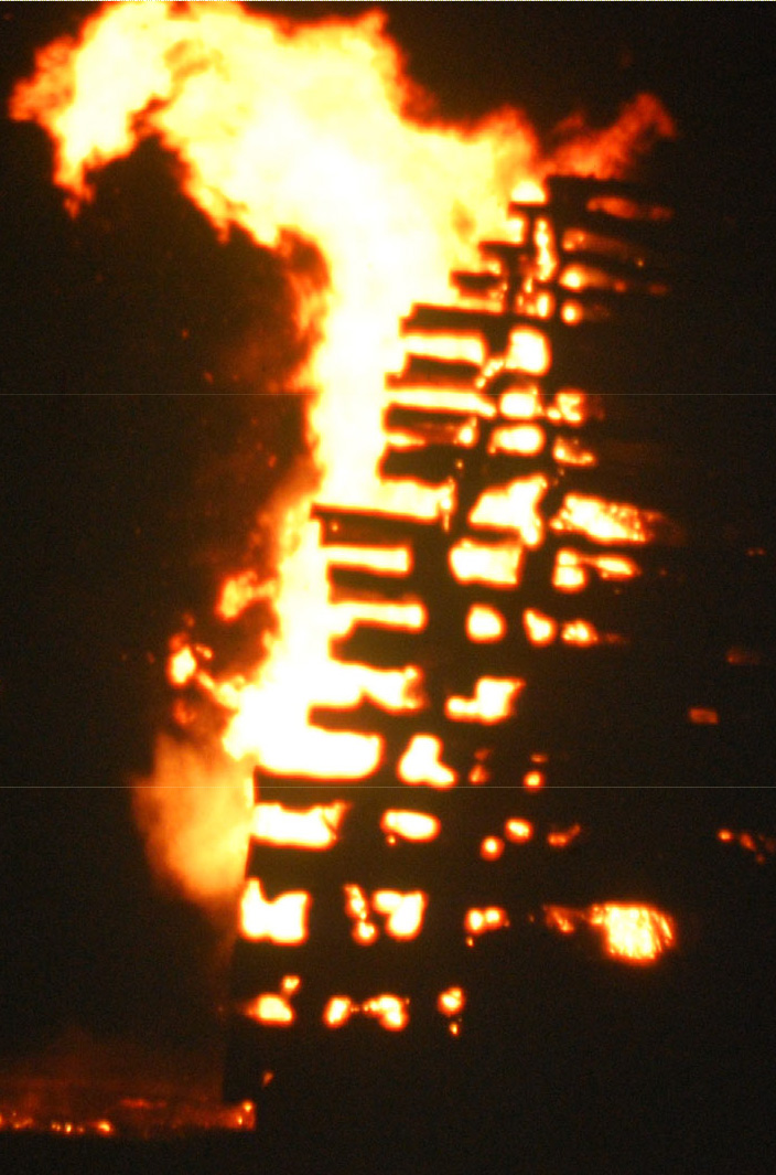 Revolutionary War beacon log tower burning at night during a Bicentennial reenactment in Union County.
