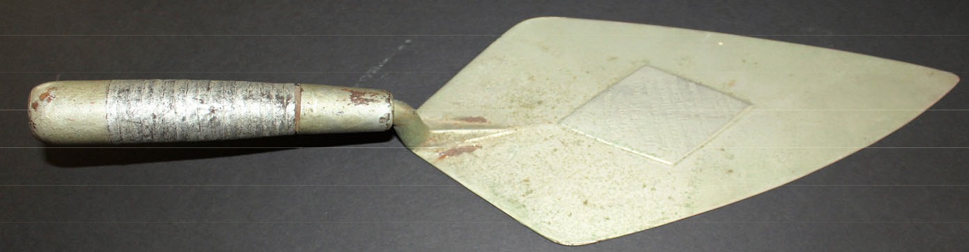 Silver-plated ceremonial trowel used by Mayor John F. Kenah to lay the cornerstone of Alexander Hamilton Junior High School in 1924.