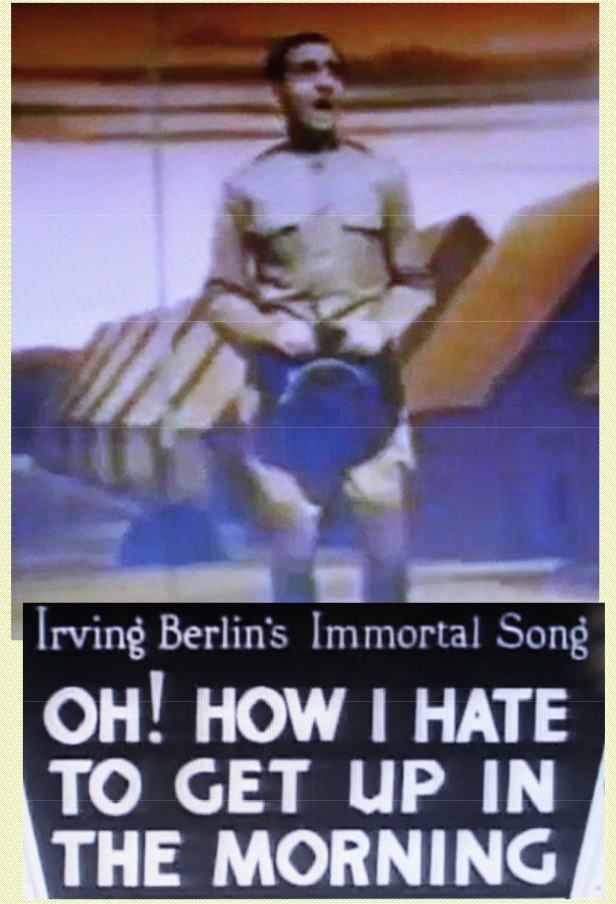 Vintage slide showing Irving Berlin in World War I uniform performing “Oh, How I Hate To Get Up In The Morning.”