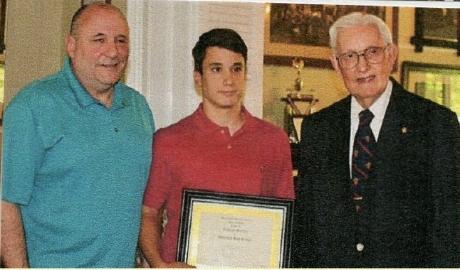 Cameron Scalera of Westfield High School receiving a UCHS student history award at the Hanson House.