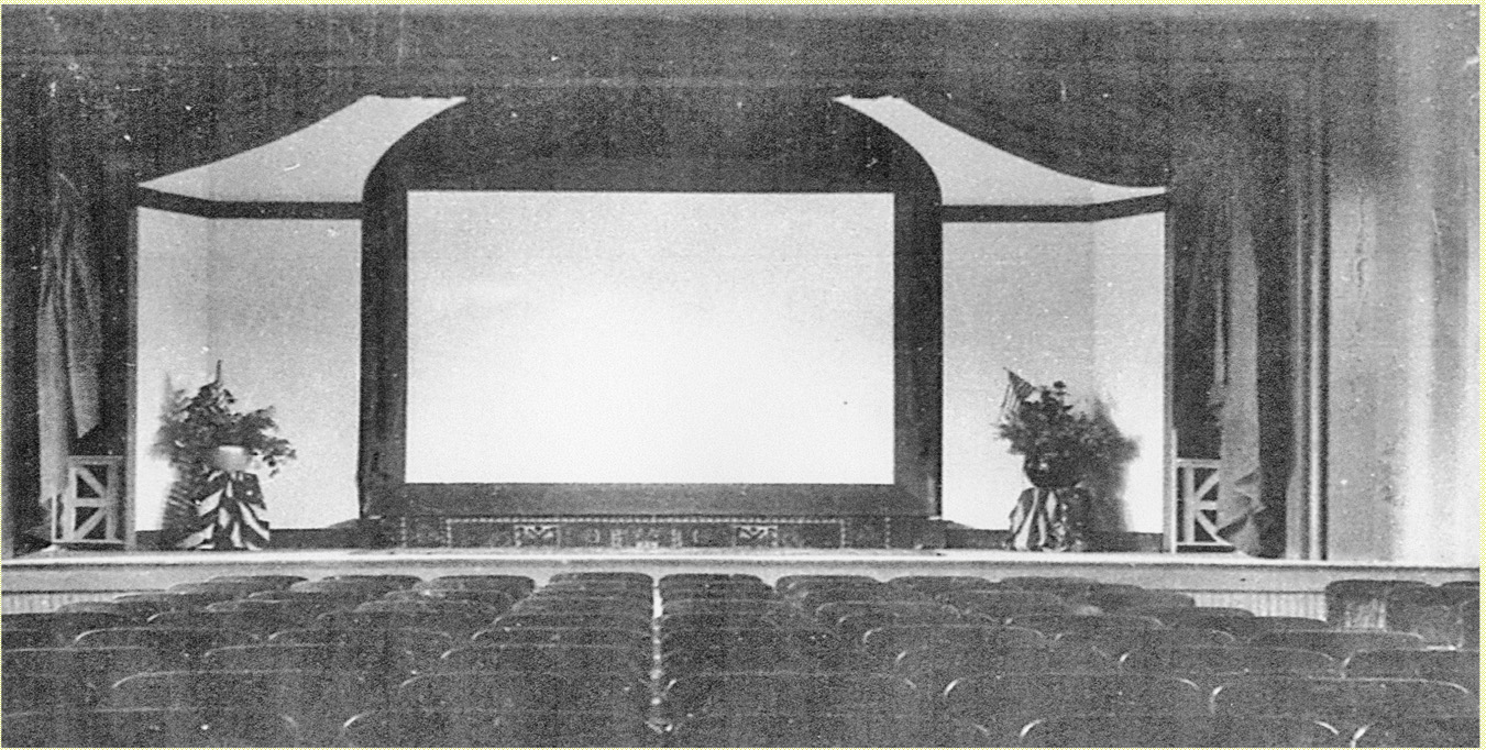 The auditorium of the original Roselle Borough Hall configured as a movie theater, with screen and stage visible.