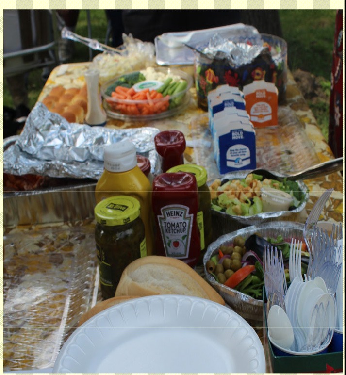 Table spread with food and condiments at the annual UCHS picnic