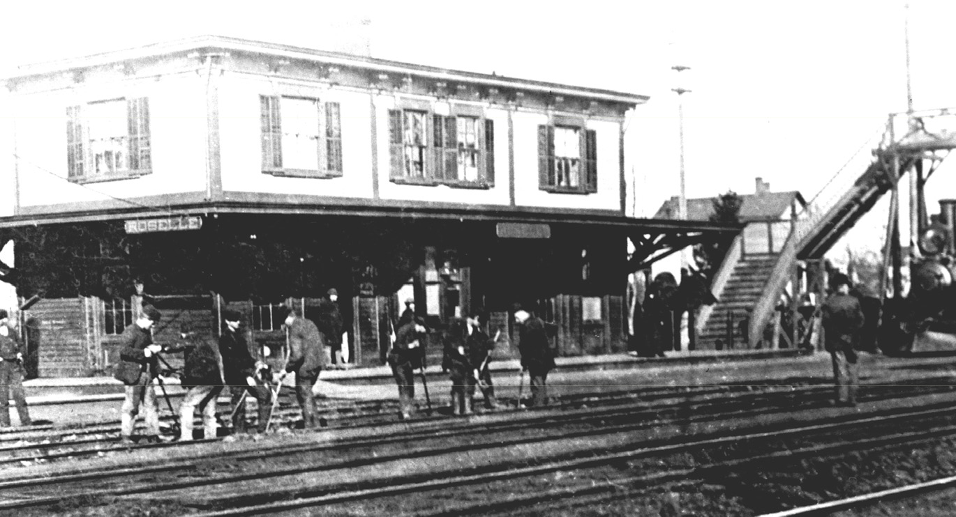 Historic Roselle train station circa 1875 with gandy dancers and elevated pedestrian crossing