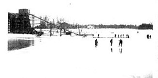 Winter scene at Ursino Lake with residents on the frozen surface