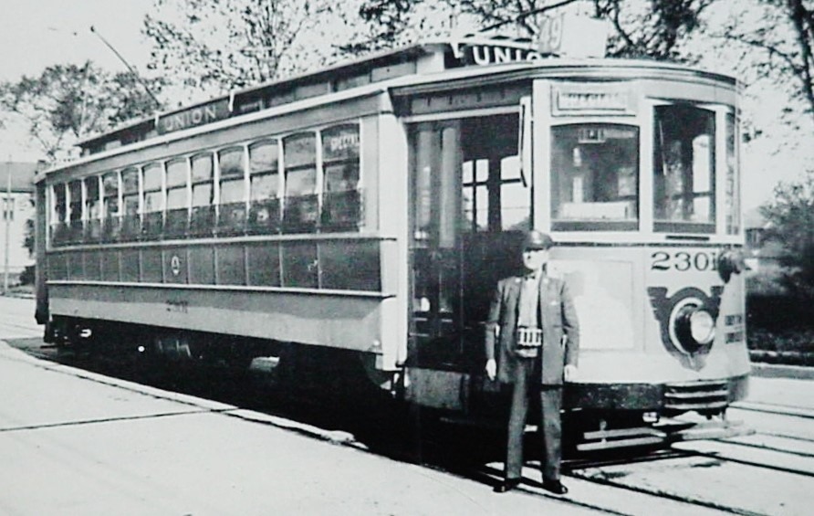 Vintage electric trolley car No. 230 with motorman, circa 1905.