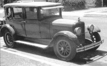 Black 1920s era sedan, likely a 1924 Rickenbacher or Franklin Touring Car, similar to the vehicle described by Bill Frolich