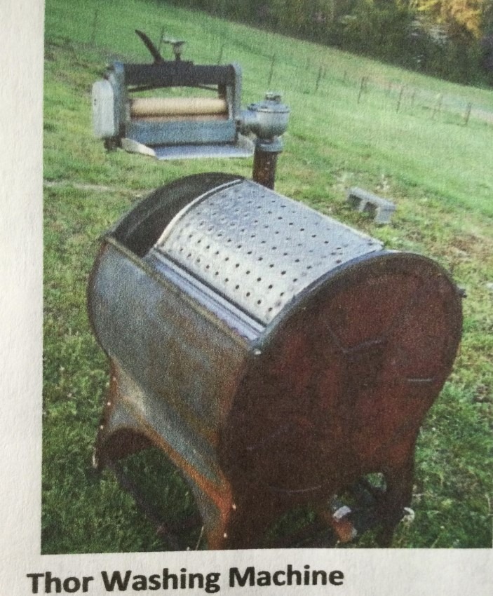 Vintage Thor washing machine with a wringer attachment, typical of early laundry routines