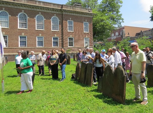 Audience gathered in the graveyard at Siloam-Hope First Presbyterian Church during the Caldwell Memorial rededication on June 21, 2025