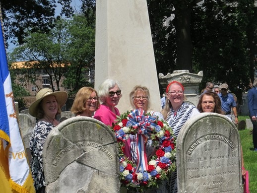 Red, white, and blue memorial wreath placed at the base of the James and Hannah Caldwell Monument during the rededication ceremony