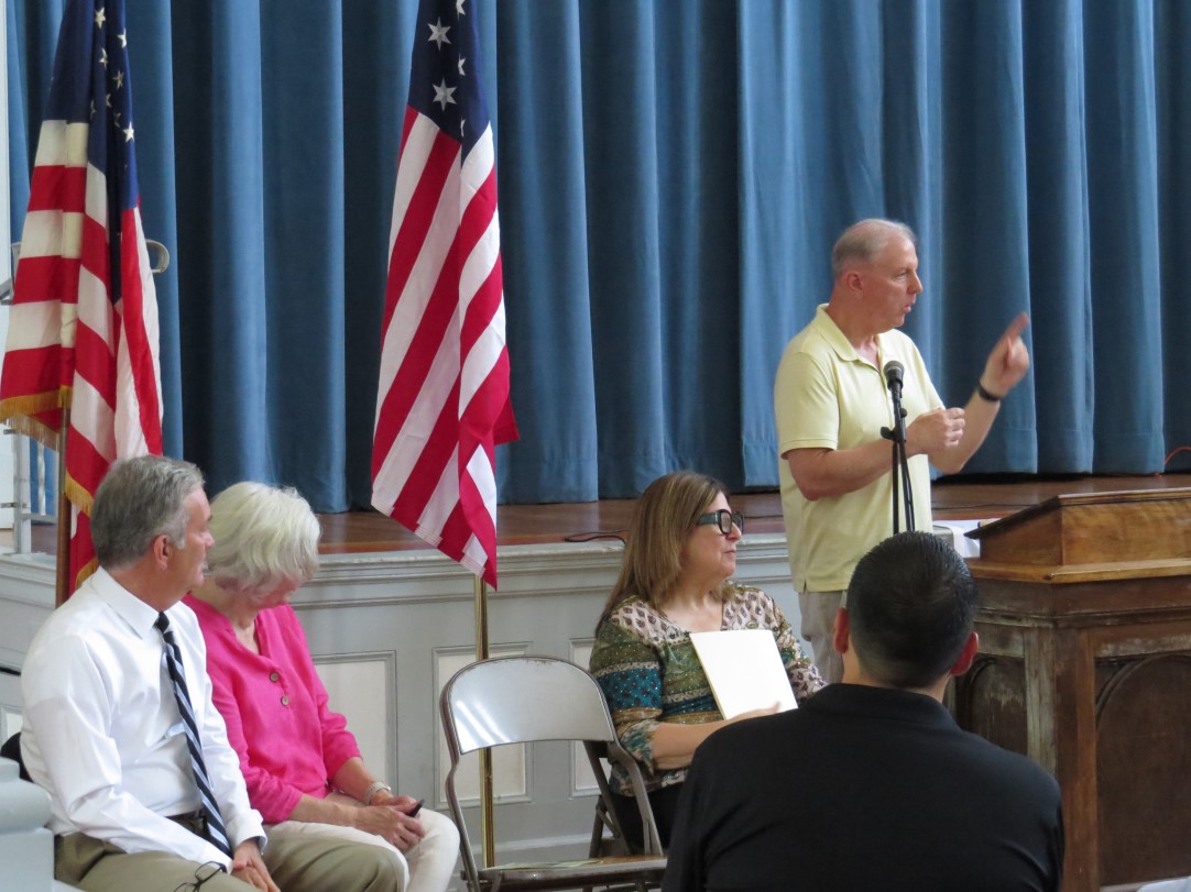 Speaker giving remarks during the Caldwell Memorial rededication program inside Snyder Academy, Elizabeth, NJ