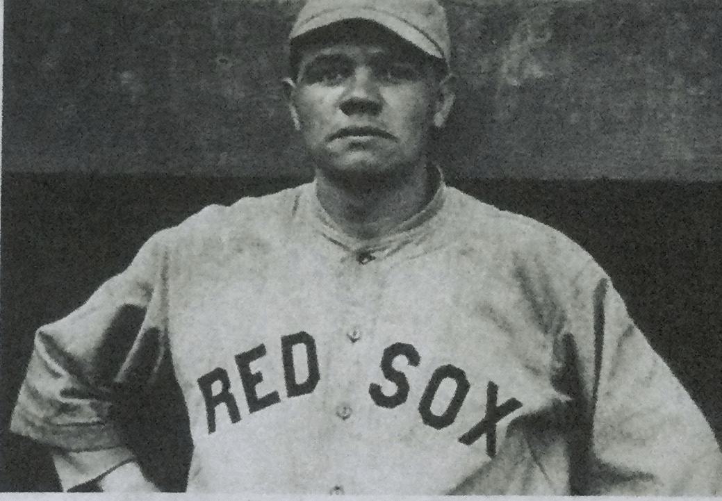 Babe Ruth posing in a Boston Red Sox uniform during his pitching era.